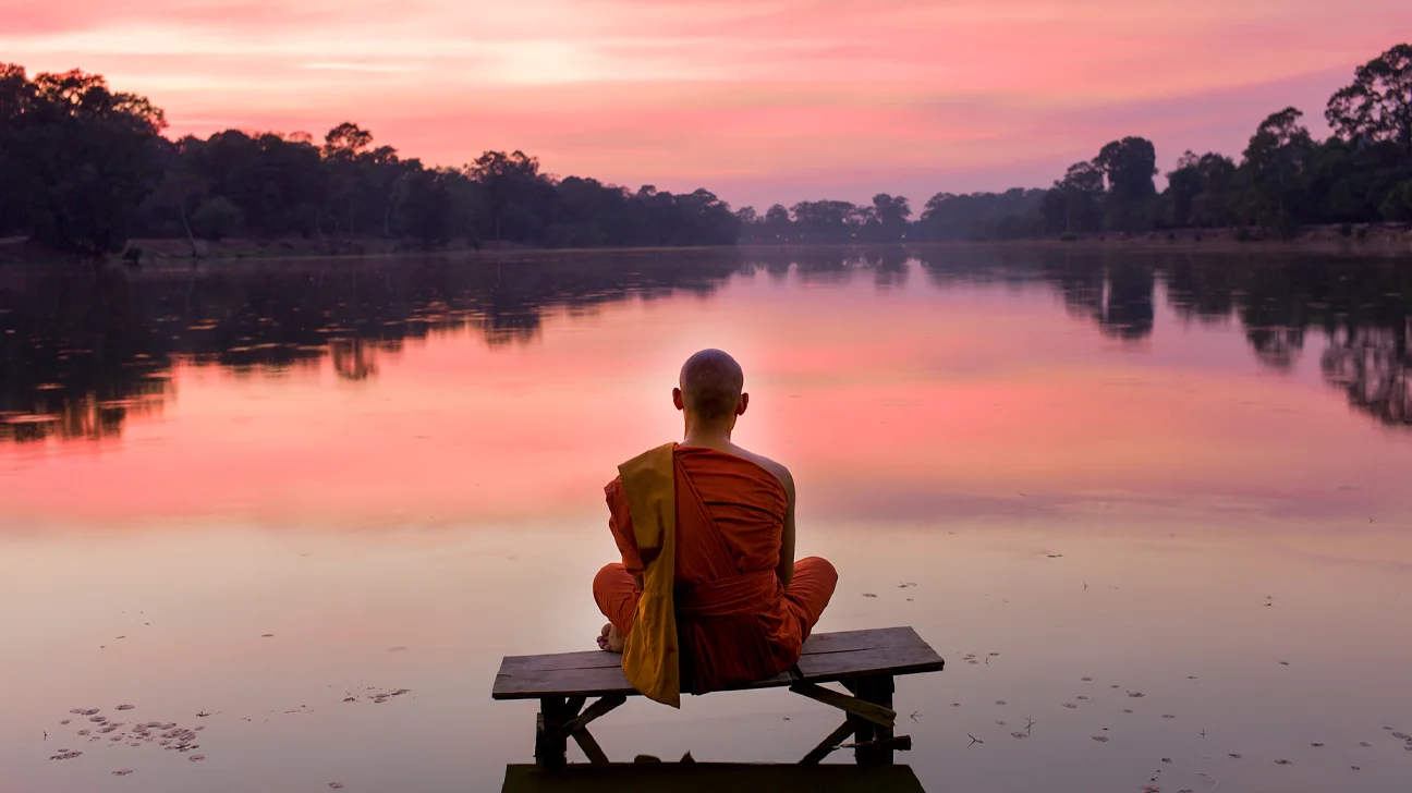 Buddhist Monk at sunset 1296x728 header