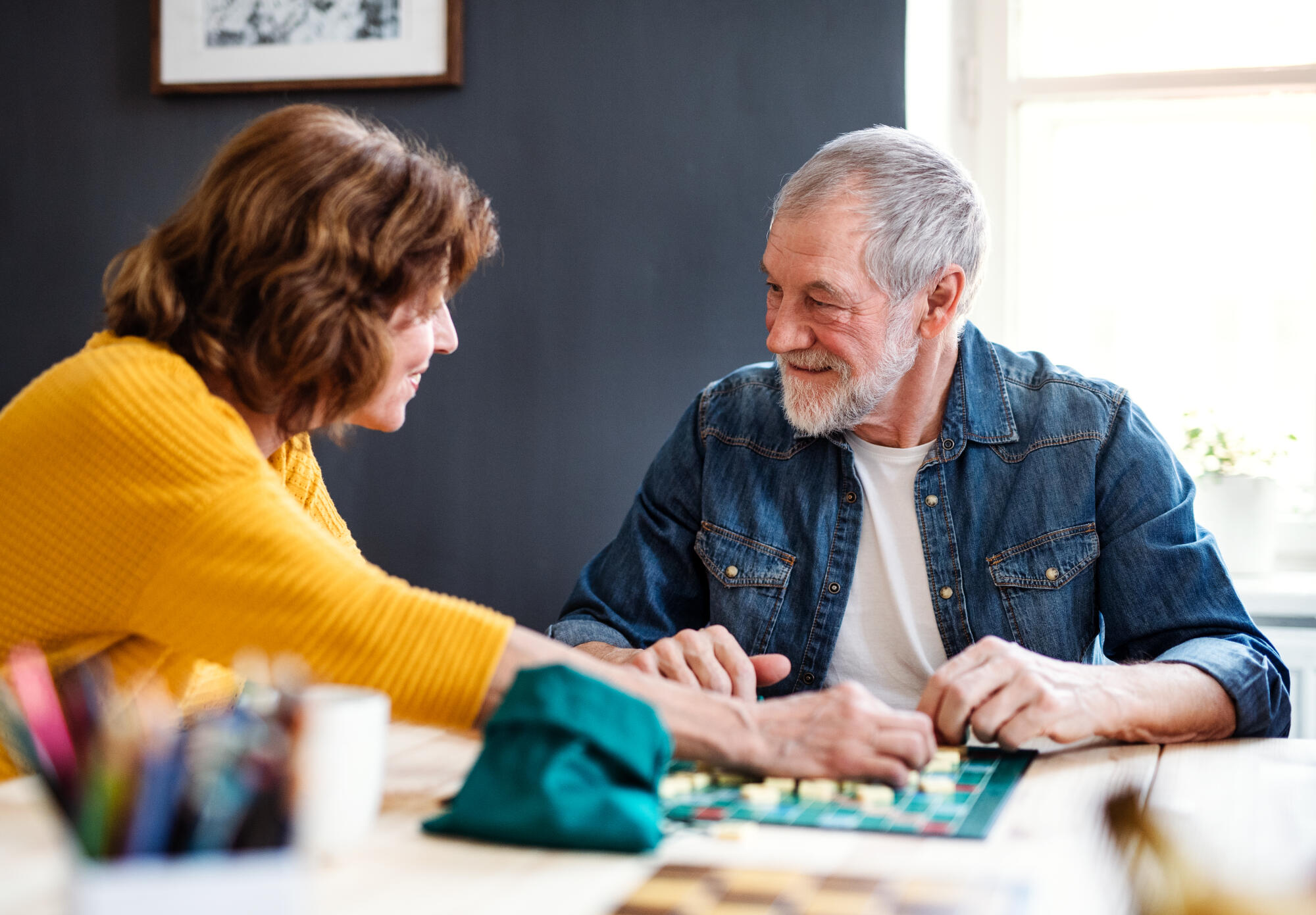 Senior couple playing board ga